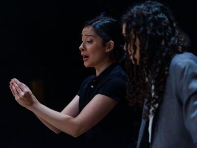 Two vocal students on stage singing